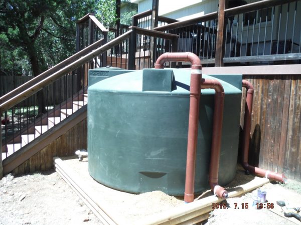 1500 gallon Dark Green rainwater collection tank installation